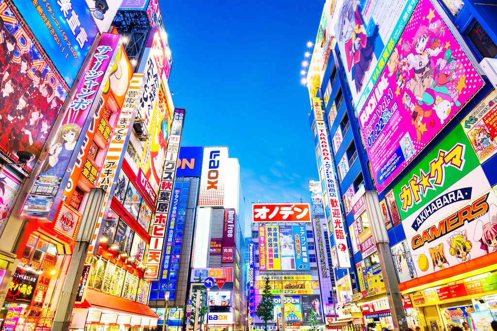  vibrant Akihabara street at night with colorful billboards and advertisements.